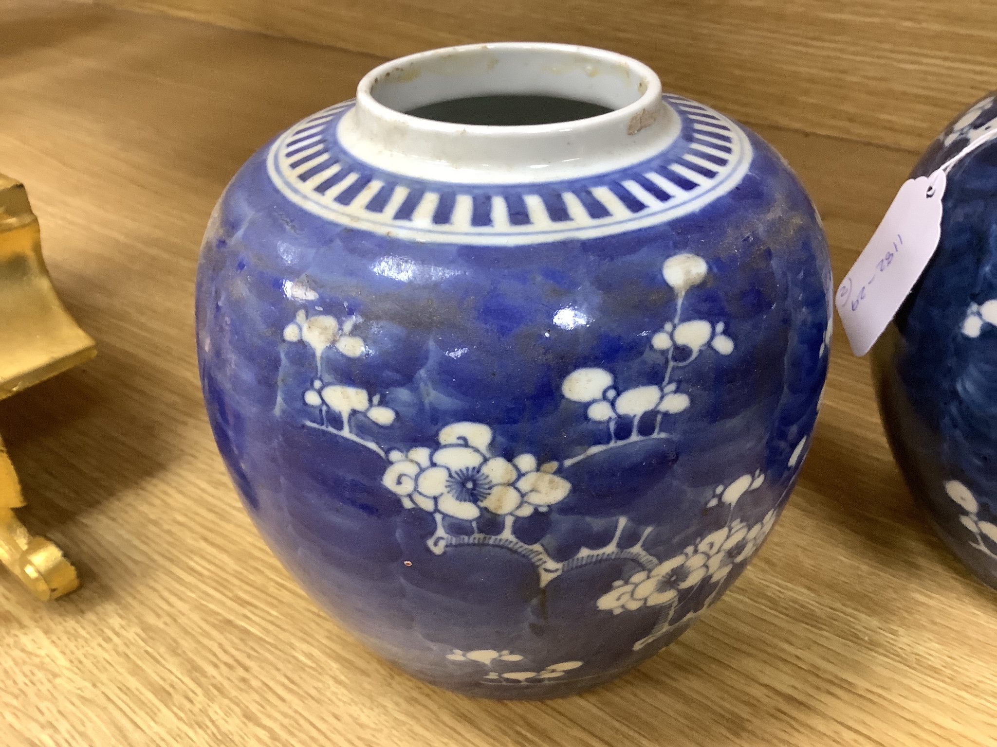 Two early 20th century Chinese blue and white prunus jars, tallest 16cm